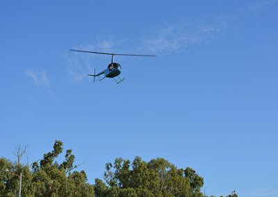 helicopter looking over fishing waters